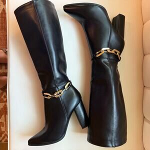 Black women boots with a gold chain detail